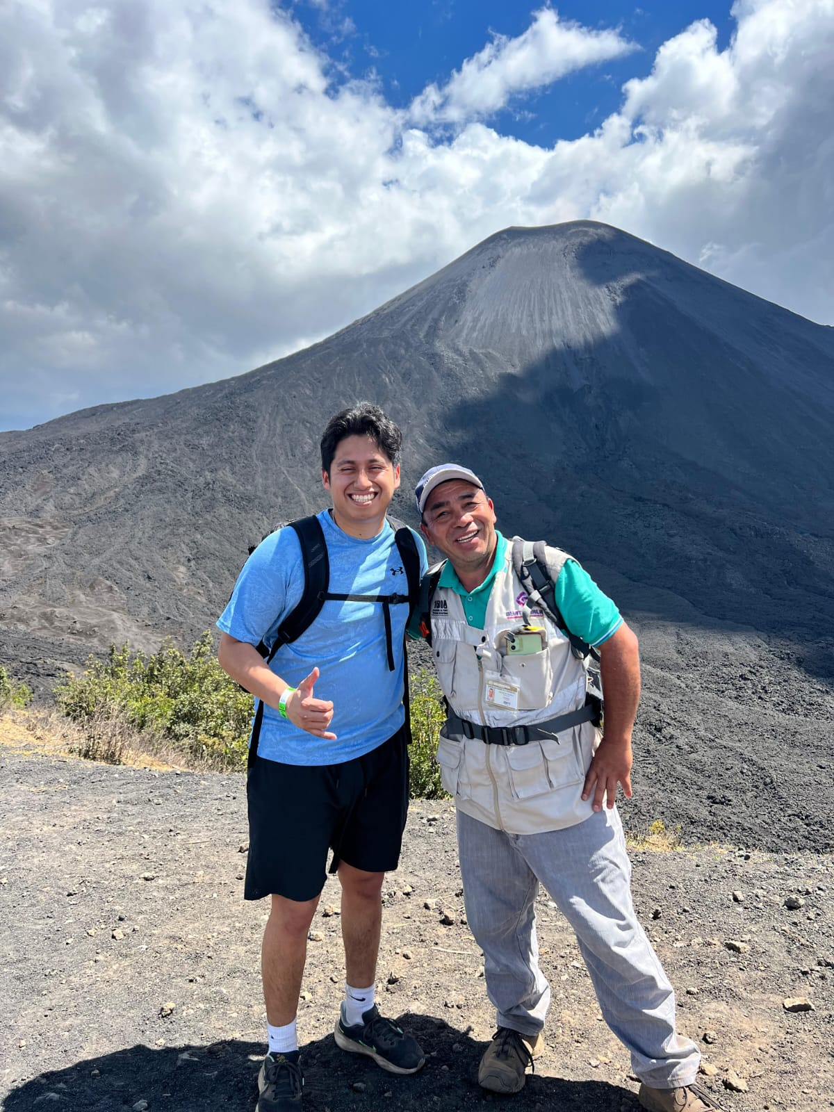 Traveler with a local guide at Pacaya Volcano
